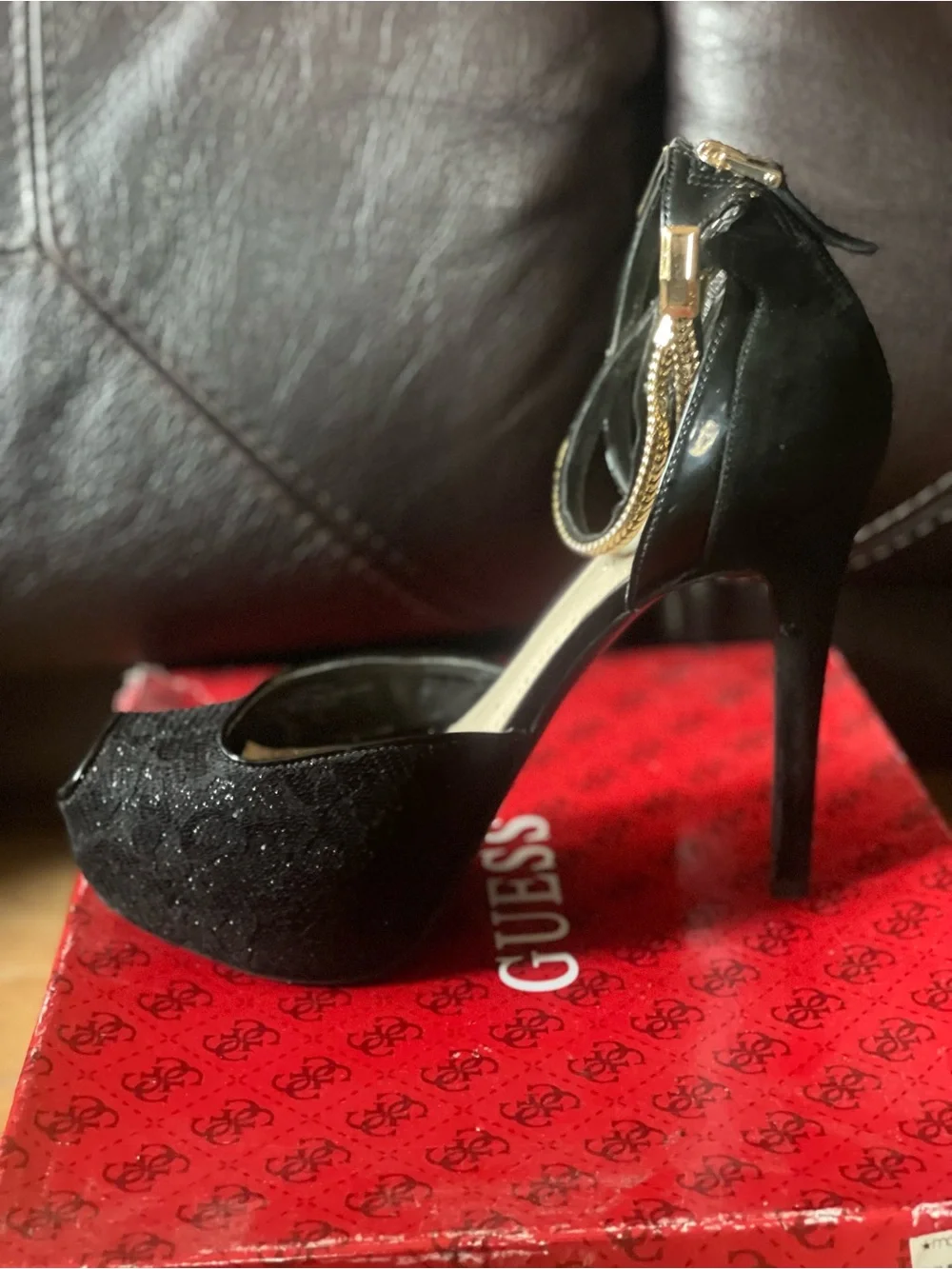 black peep-toe platform high heels by Guess featuring metallic gold double-wrap